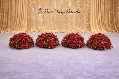 Red rose arrangements on gold sequin