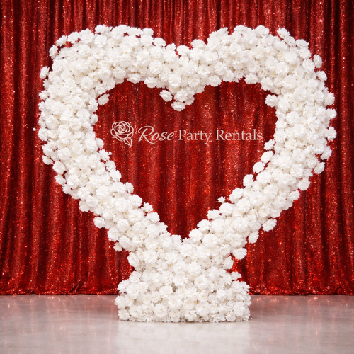 White floral heart arch on red sequin